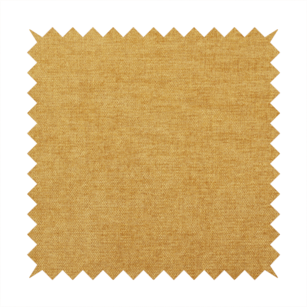 A textured, golden yellow or mustard woven upholstery fabric.