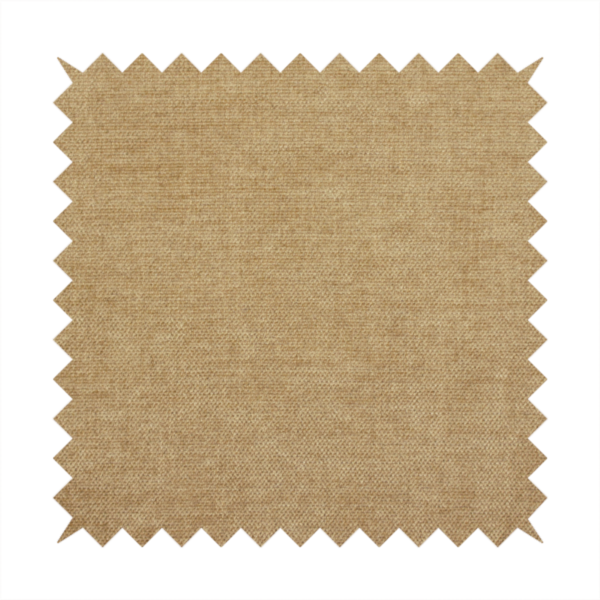 A textured, light brown or camel-coloured woven upholstery fabric.