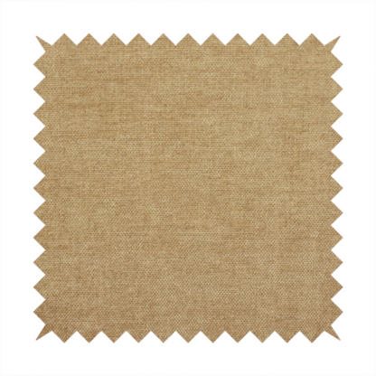 A textured, light brown or camel-coloured woven upholstery fabric.