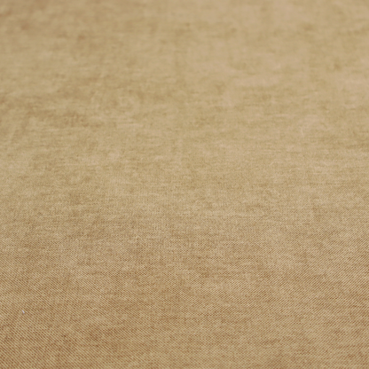 A textured, light brown or camel-coloured woven upholstery fabric.