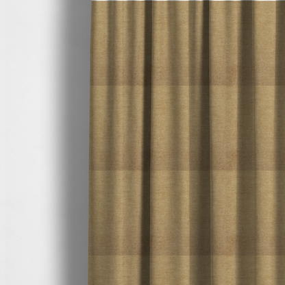 The fabric used to create these made-to-measure curtains is a textured, light brown or camel-coloured woven upholstery fabric.