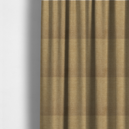 The fabric used to create these made-to-measure curtains is a textured, light brown or camel-coloured woven upholstery fabric.