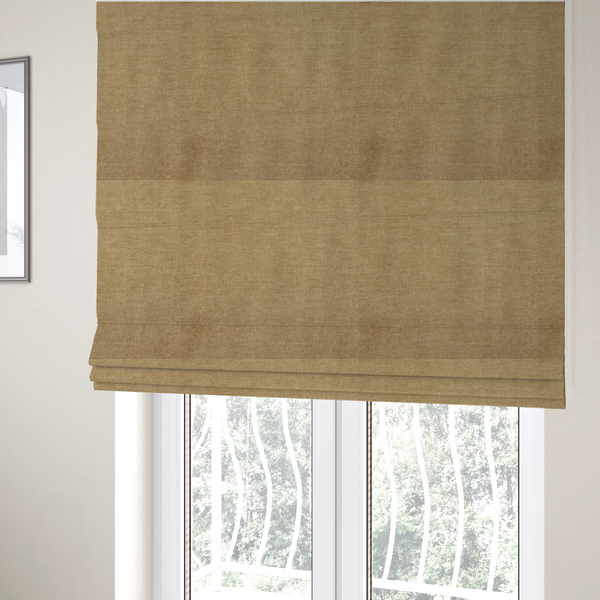 The fabric used to create these Roman blinds is a textured, light brown or camel-coloured woven upholstery fabric.