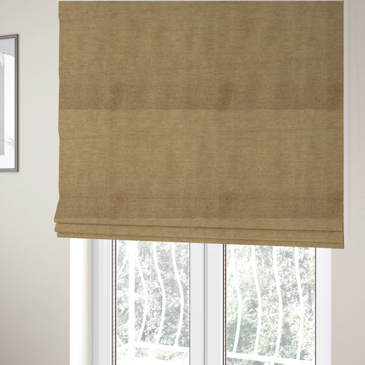 The fabric used to create these Roman blinds is a textured, light brown or camel-coloured woven upholstery fabric.