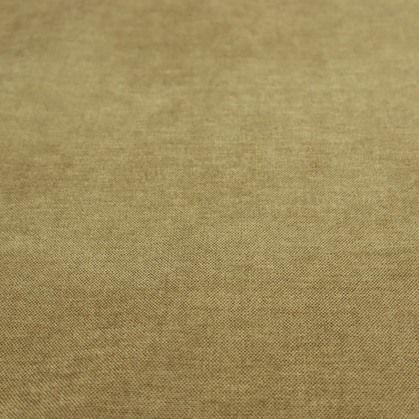 A textured, olive green or muted bronze woven upholstery fabric.