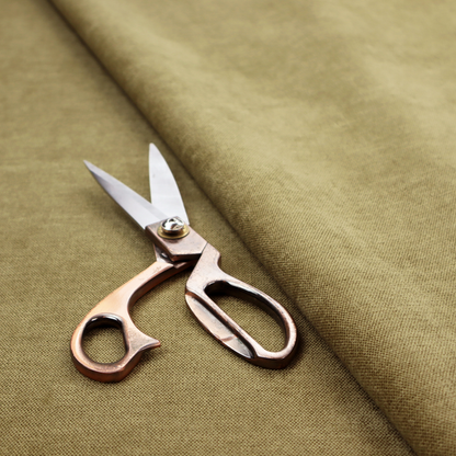 A textured, olive green or muted bronze woven upholstery fabric.