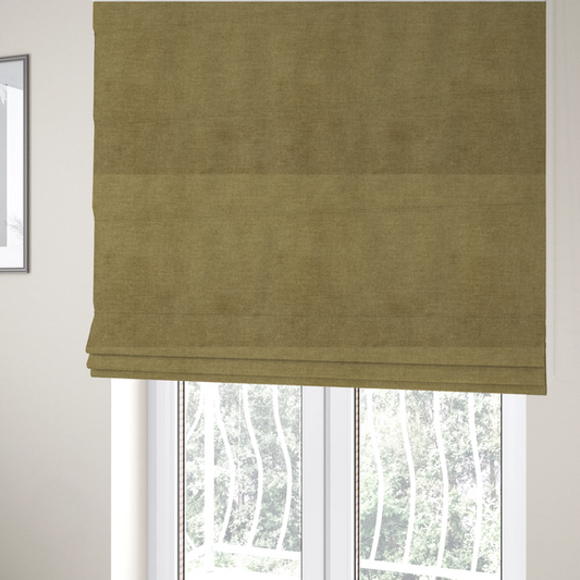 The fabric used to create these Roman blinds is a textured, olive green or muted bronze woven upholstery fabric.