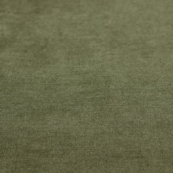 A textured, deep sage green or moss green woven upholstery fabric.