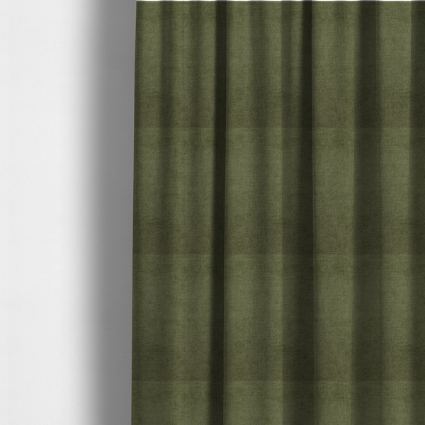 The fabric used to create these made-to-measure curtains is a textured, deep sage green or moss green woven upholstery fabric.