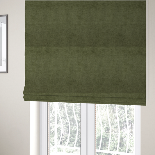 The fabric used to create these Roman blinds is a textured, deep sage green or moss green woven upholstery fabric.