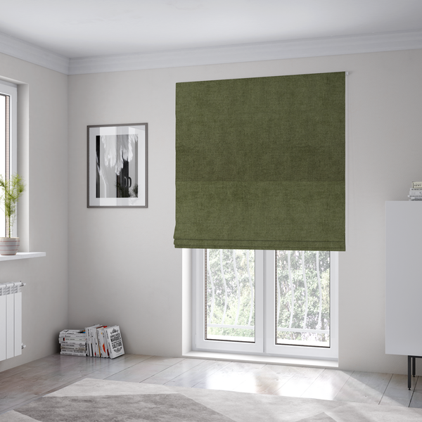 The fabric used to create these Roman blinds is a textured, deep sage green or moss green woven upholstery fabric.