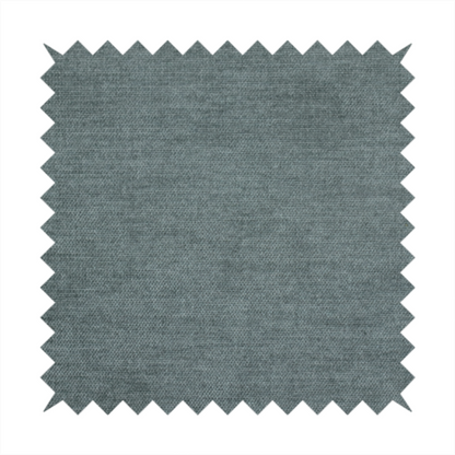 A textured, grey-blue or muted teal woven upholstery fabric.