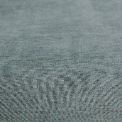 A textured, grey-blue or muted teal woven upholstery fabric.