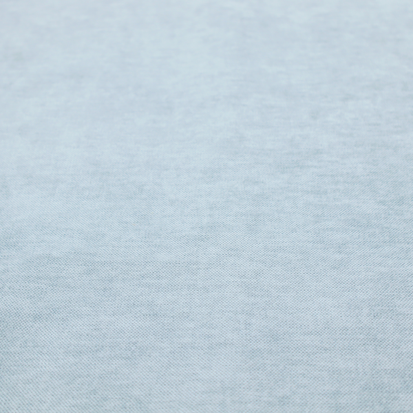 A textured, light blue or pale sky blue woven upholstery fabric.