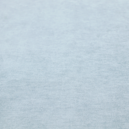 A textured, light blue or pale sky blue woven upholstery fabric.