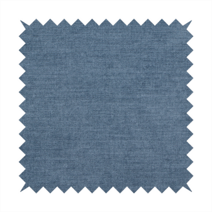 A textured, denim blue or dusty blue woven upholstery fabric.