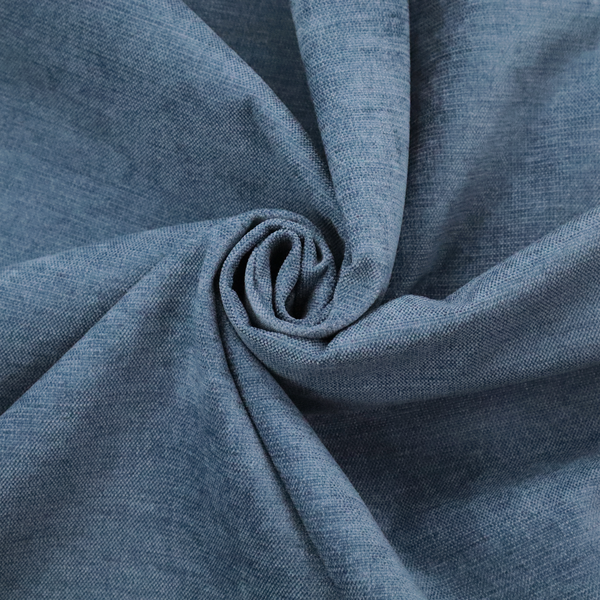 A textured, denim blue or dusty blue woven upholstery fabric.