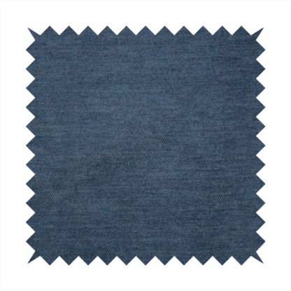 A textured, dark denim blue or navy blue woven upholstery fabric.