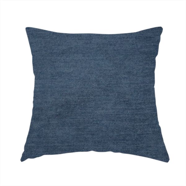 the fabric used to create this handmade cushion is a textured, dark denim blue or navy blue woven upholstery fabric.