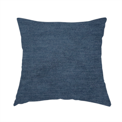 the fabric used to create this handmade cushion is a textured, dark denim blue or navy blue woven upholstery fabric.