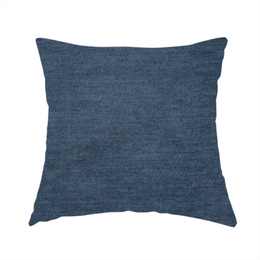 the fabric used to create this handmade cushion is a textured, dark denim blue or navy blue woven upholstery fabric.