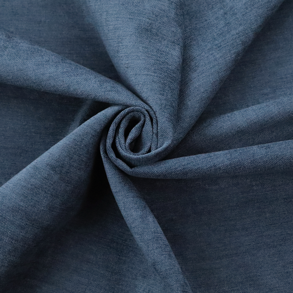 A textured, dark denim blue or navy blue woven upholstery fabric.