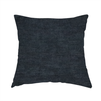 The fabric used to create this handmade cushion is a textured, dark charcoal grey or near-black woven upholstery fabric.