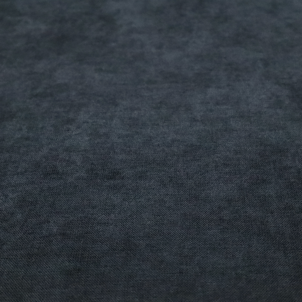 A textured, dark charcoal grey or near-black woven upholstery fabric.