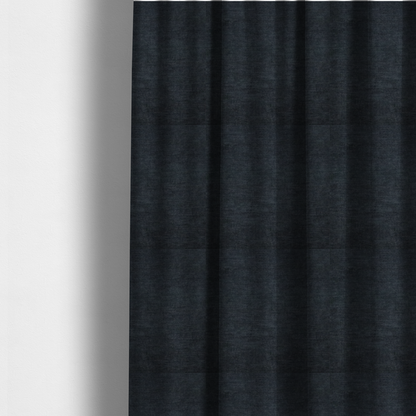 The fabric used to create these made-to-measure curtains is a textured, dark charcoal grey or near-black woven upholstery fabric.