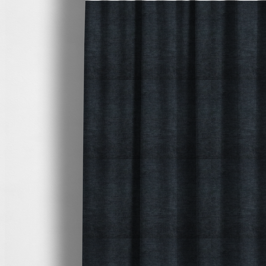 The fabric used to create these made-to-measure curtains is a textured, dark charcoal grey or near-black woven upholstery fabric.