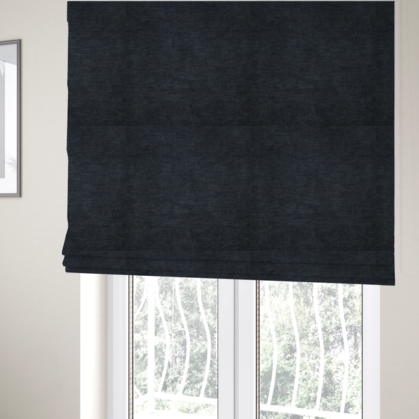 The fabric used to create these Roman blinds is a textured, dark charcoal grey or near-black woven upholstery fabric.