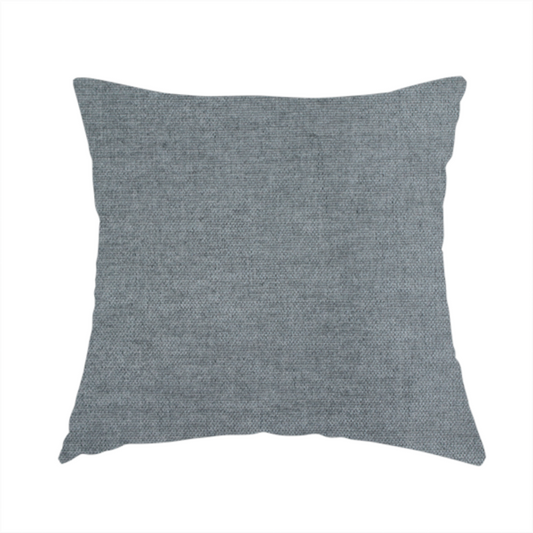 The fabric used to create this handmade cushion is a textured, medium grey or steel grey woven upholstery fabric.