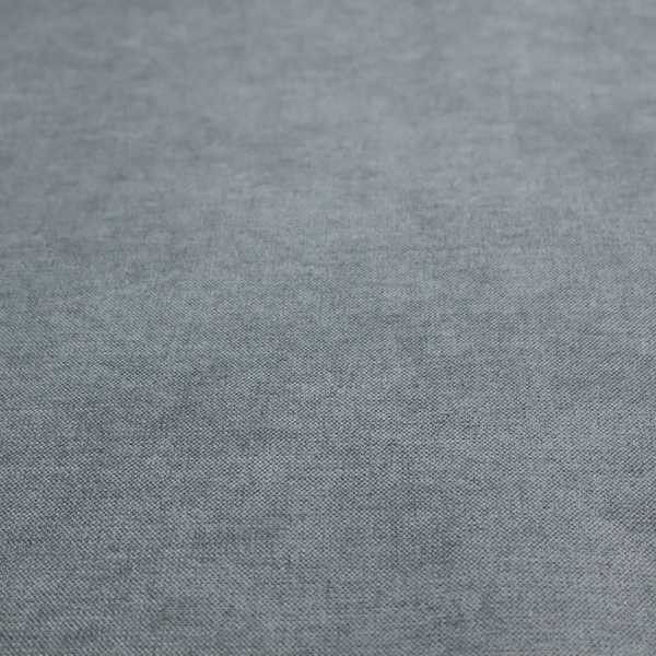 A textured, medium grey or steel grey woven upholstery fabric.