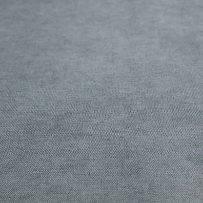 A textured, medium grey or steel grey woven upholstery fabric.