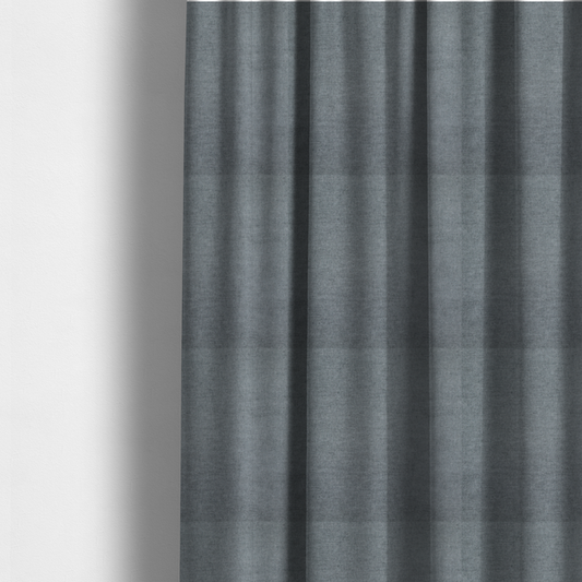 The fabric used to create these made-to-measure curtains is a textured, medium grey or steel grey woven upholstery fabric.