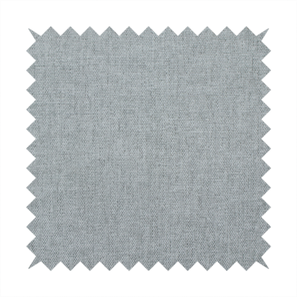 A textured, light grey or silver grey woven upholstery fabric.