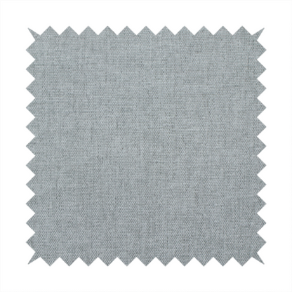 A textured, light grey or silver grey woven upholstery fabric.