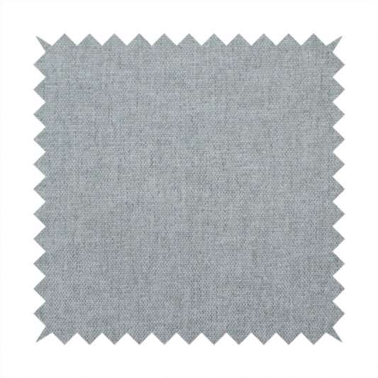 A textured, light grey or silver grey woven upholstery fabric.