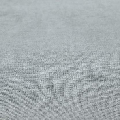 A textured, light grey or silver grey woven upholstery fabric.
