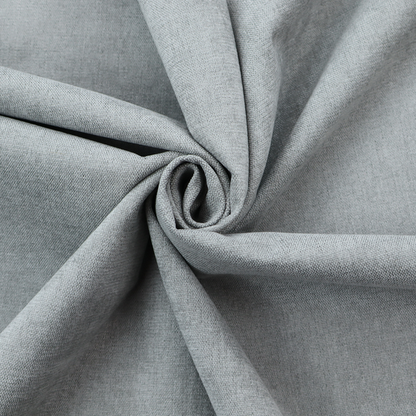 A textured, light grey or silver grey woven upholstery fabric.