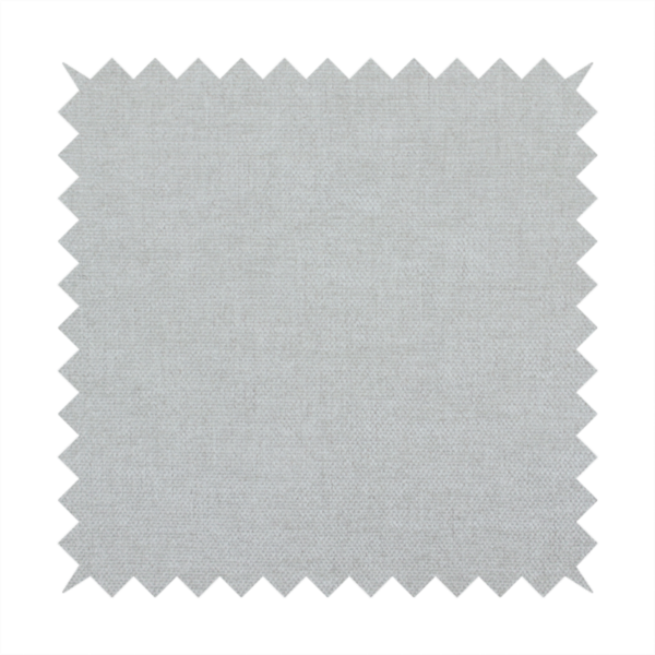 A textured, very light grey or off-white woven upholstery fabric.