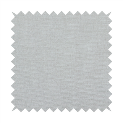 A textured, very light grey or off-white woven upholstery fabric.