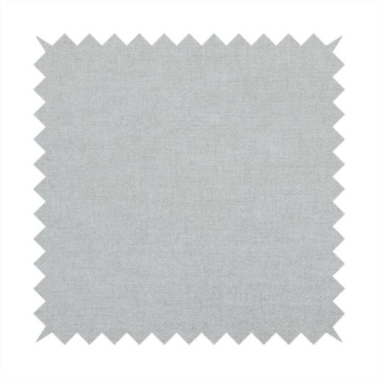 A textured, very light grey or off-white woven upholstery fabric.