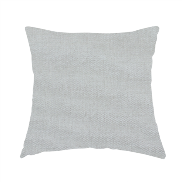 The fabric used to create this handmade cushion is a textured, very light grey or off-white woven upholstery fabric.