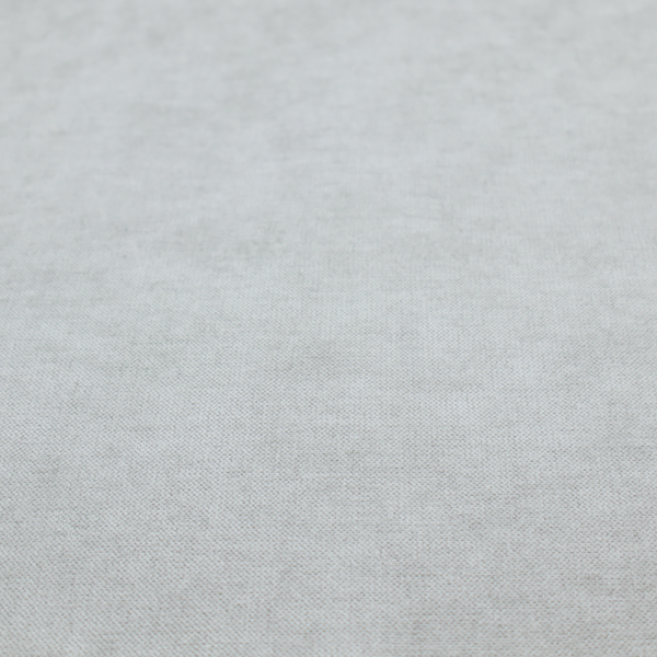 A textured, very light grey or off-white woven upholstery fabric.