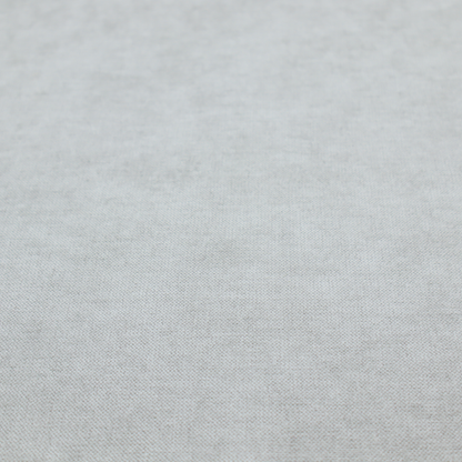 A textured, very light grey or off-white woven upholstery fabric.