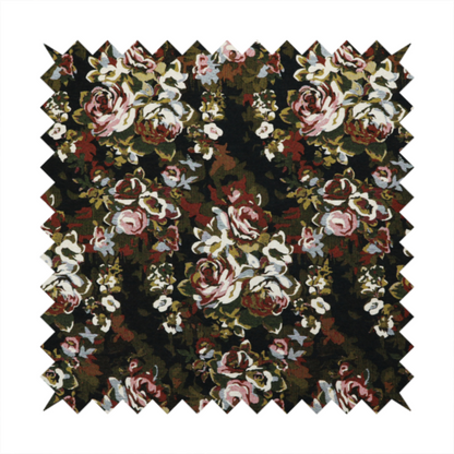 A repeating vintage floral pattern on a dark black and olive green woven fabric background. The pattern features clusters of blooming roses in shades of dusty pink, burgundy, cream, and muted light blue, accompanied by small accent flowers and olive green leaves.   
