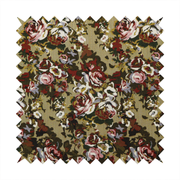 A repeating vintage floral pattern on a warm gold and beige textured woven fabric background. The design features dense clusters of blooming roses in shades of dusty pink, deep red, cream, and muted lavender, surrounded by olive green and dark foliage.   
