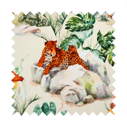 A tropical fabric pattern featuring leopards lounging on rocks amidst lush green foliage, palm fronds, and vibrant orange birds against a light background.