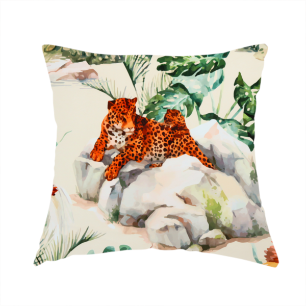 The fabric used to create this handmade cushion is a tropical fabric pattern featuring leopards lounging on rocks amidst lush green foliage, palm fronds, and vibrant orange birds against a light background.